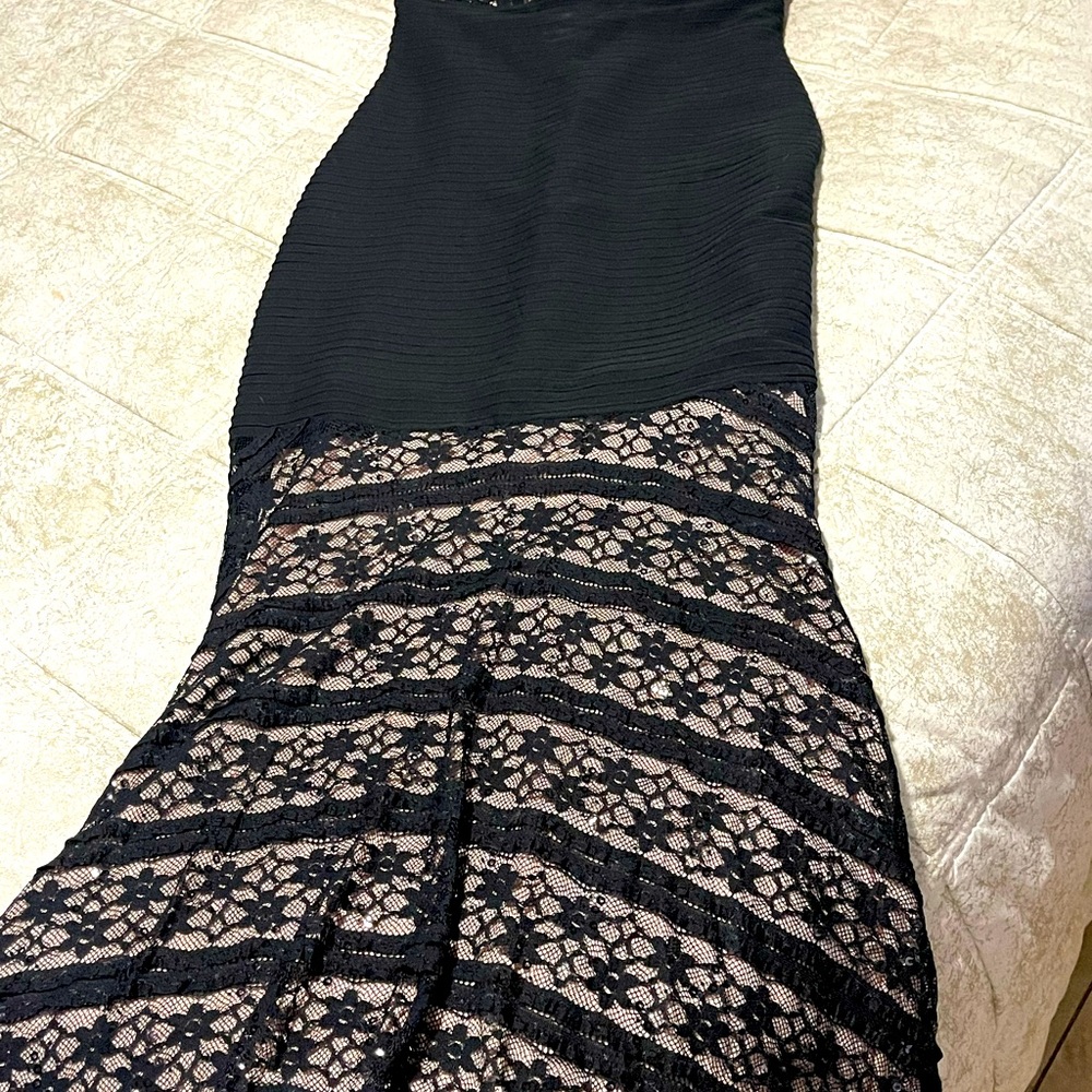 Very nice evning dress color black and cream lace size 10